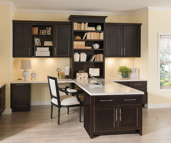 Chocolate cabinets in a home office by Kemper Cabinetry