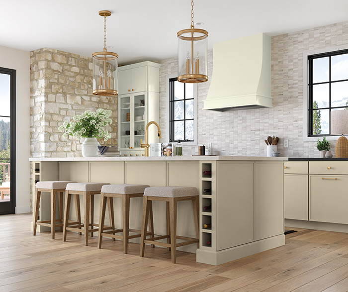 light color kitchen cabinets with wine storage kitchen island, stove hood and glass front cabinets